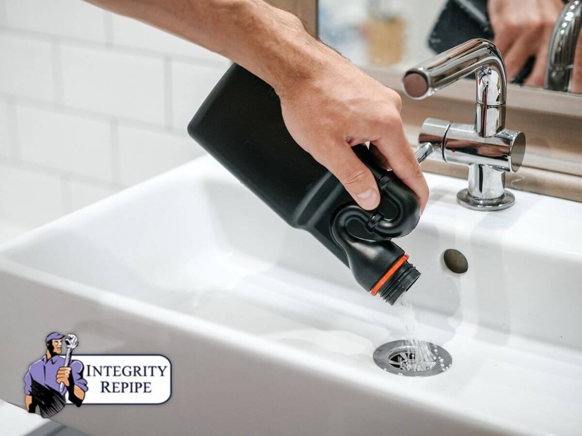 Man putting drain cleaner in the sink without think that it can negatively impact the plumbing